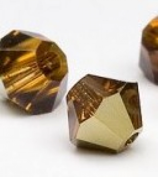 Swarovskiperle 4mm bic. Topaz Dorado 36 St